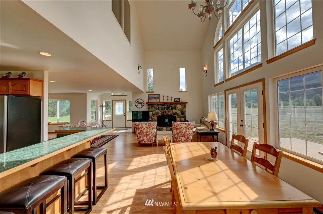 36 Beaver Pond Road Twisp, WA 98856 - Photo 25 of 40 a living room with fireplace furniture and a flat screen tv
