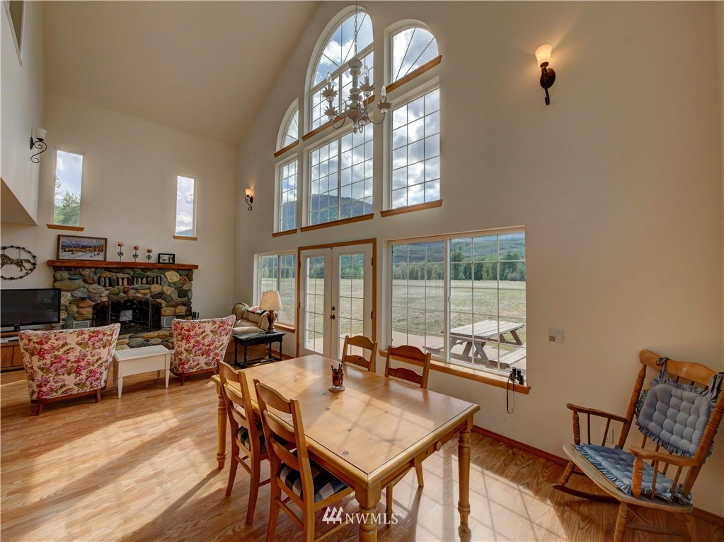 36 Beaver Pond Road Twisp, WA 98856 - Photo 26 of 40 a living room with furniture a fireplace and a large window