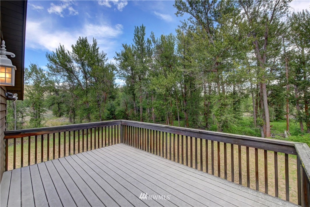 36 Beaver Pond Road Twisp, WA 98856 - Photo 31 of 40 a view of balcony with wooden floor and fence