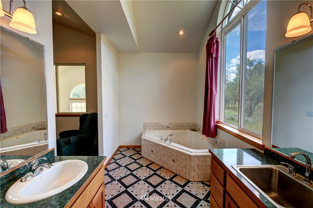 36 Beaver Pond Road Twisp, WA 98856 - Photo 34 of 40 a bathroom with a sink and a mirror