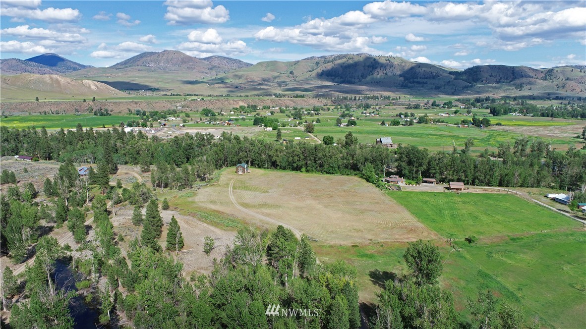 36 Beaver Pond Road Twisp, WA 98856 - Photo 40 of 40 a view of a city with lush green forest
