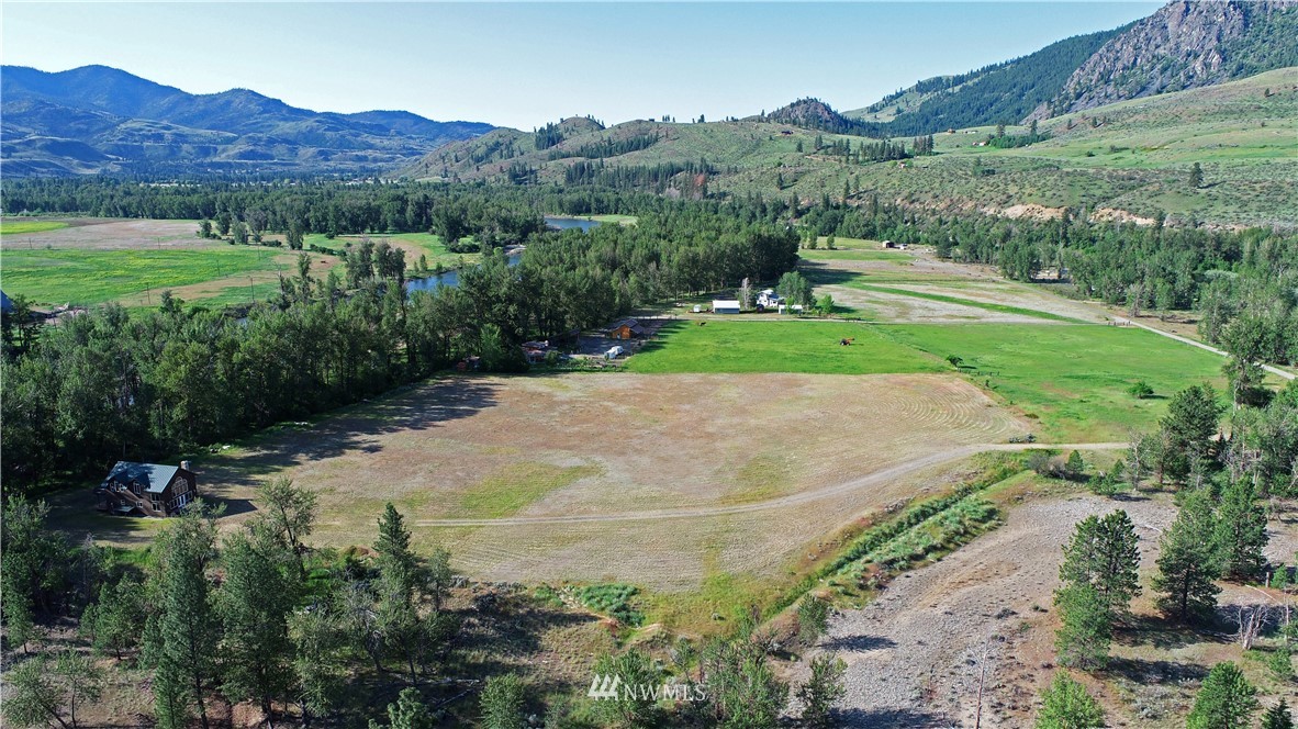 36 Beaver Pond Road Twisp, WA 98856 - Photo 8 of 40 a view of a lush green hillside and houses