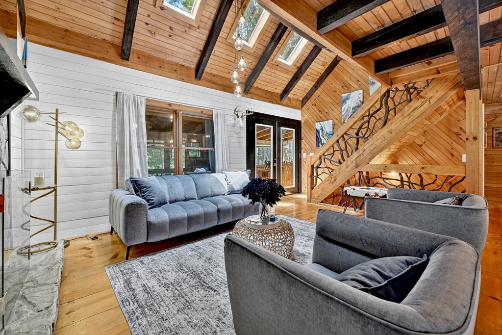 100 Stanley Creek Road Cherry Log, GA 30522 - Photo 11 of 81 a living room with furniture and a fireplace