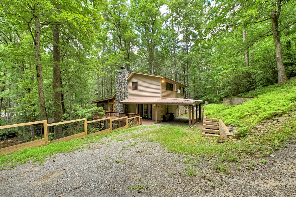 100 Stanley Creek Road Cherry Log, GA 30522 - Photo 13 of 81 a view of a house with backyard wooden deck and sitting area