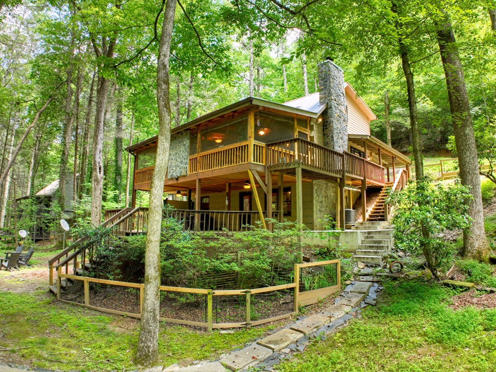 100 Stanley Creek Road Cherry Log, GA 30522 - Photo 22 of 81 a front view of a house with a yard