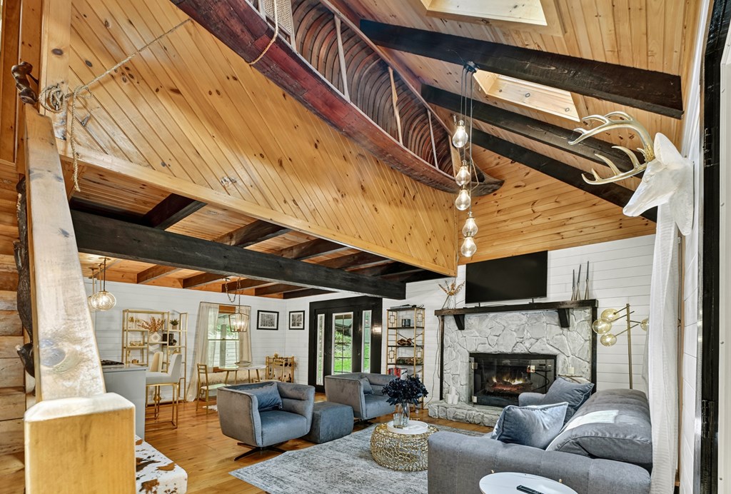 100 Stanley Creek Road Cherry Log, GA 30522 - Photo 23 of 81 a living room with furniture and a fireplace