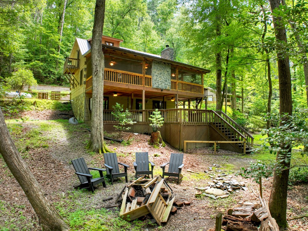 100 Stanley Creek Road Cherry Log, GA 30522 - Photo 48 of 81 a view of a patio with table and chairs under an umbrella