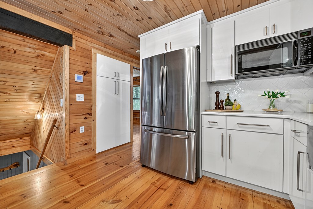 100 Stanley Creek Road Cherry Log, GA 30522 - Photo 49 of 81 a kitchen with stainless steel appliances a refrigerator microwave and sink