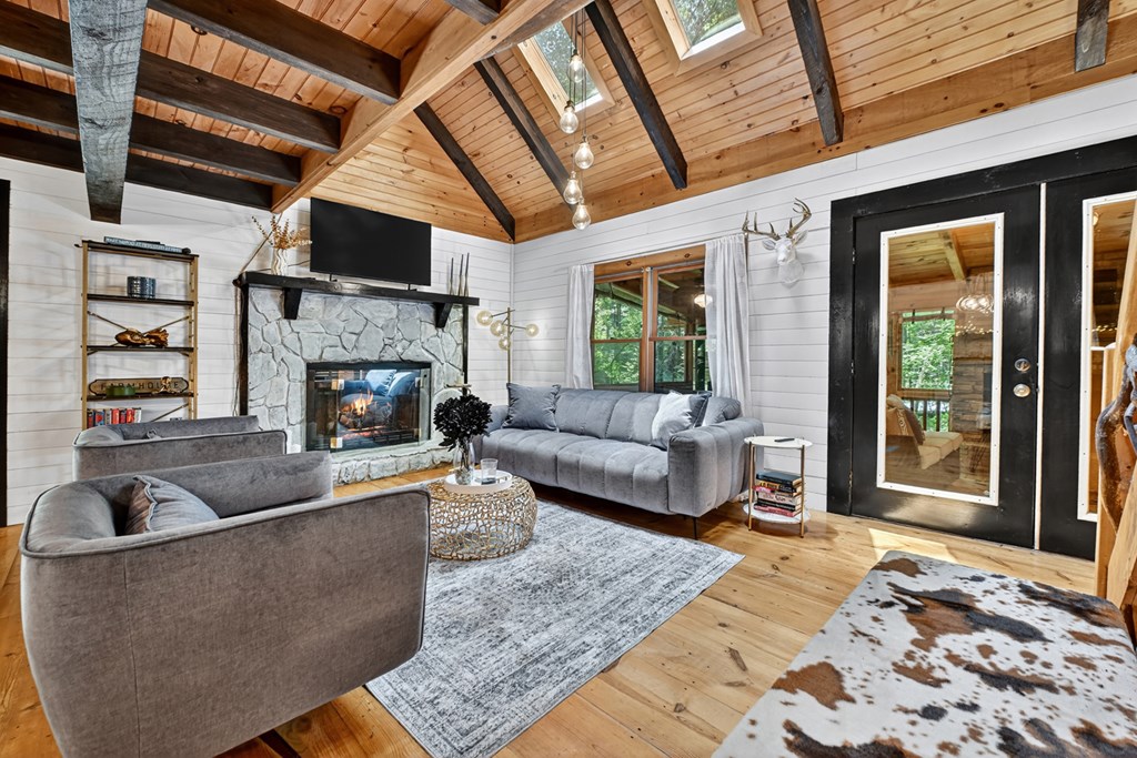 100 Stanley Creek Road Cherry Log, GA 30522 - Photo 5 of 81 a living room with furniture and a fireplace