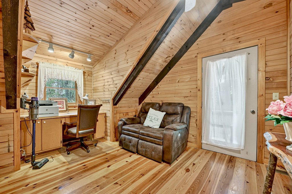 100 Stanley Creek Road Cherry Log, GA 30522 - Photo 59 of 81 a living room with furniture and a floor to ceiling window