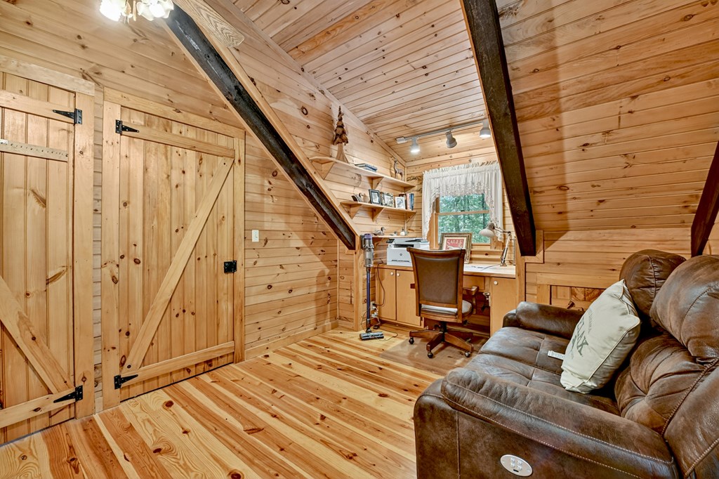 100 Stanley Creek Road Cherry Log, GA 30522 - Photo 60 of 81 a view of a couches with wooden floor and city view