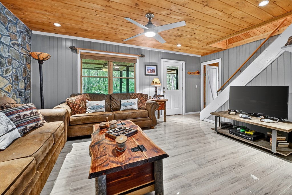 100 Stanley Creek Road Cherry Log, GA 30522 - Photo 6 of 81 a living room with furniture and a flat screen tv