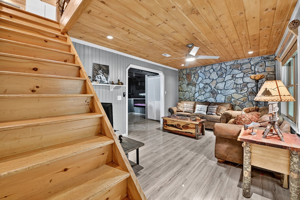 100 Stanley Creek Road Cherry Log, GA 30522 - Photo 74 of 81 a bedroom with furniture and a wooden floor