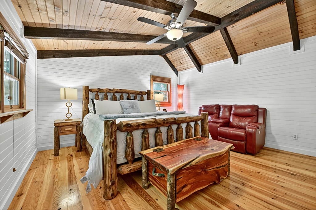 100 Stanley Creek Road Cherry Log, GA 30522 - Photo 8 of 81 a bedroom with furniture and wooden floor