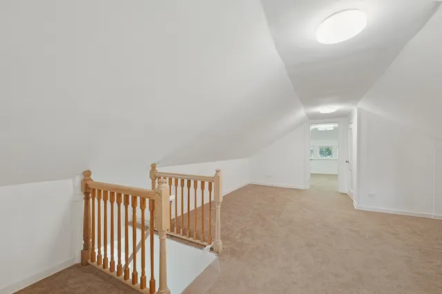 a view of a hallway with staircase