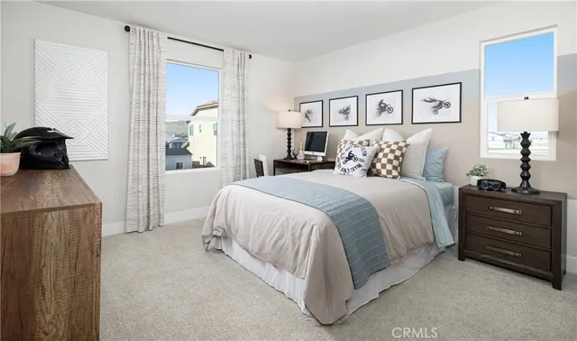 a spacious bedroom with a bed and a dresser