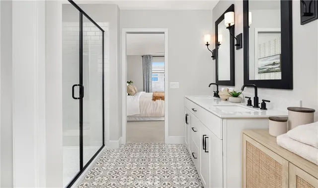 a bathroom with a double vanity sink mirror and toilet