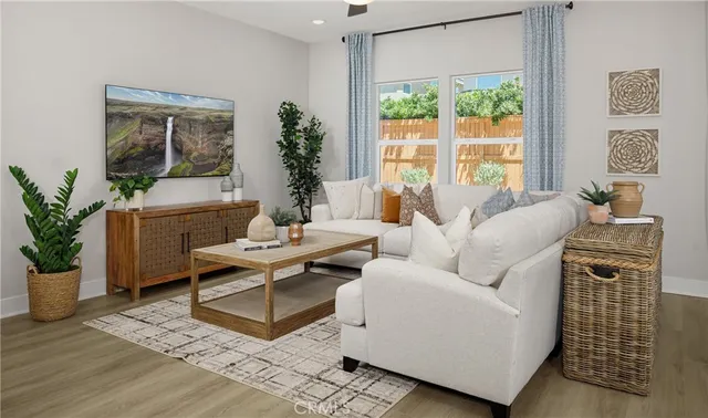 a living room with furniture and a potted plant