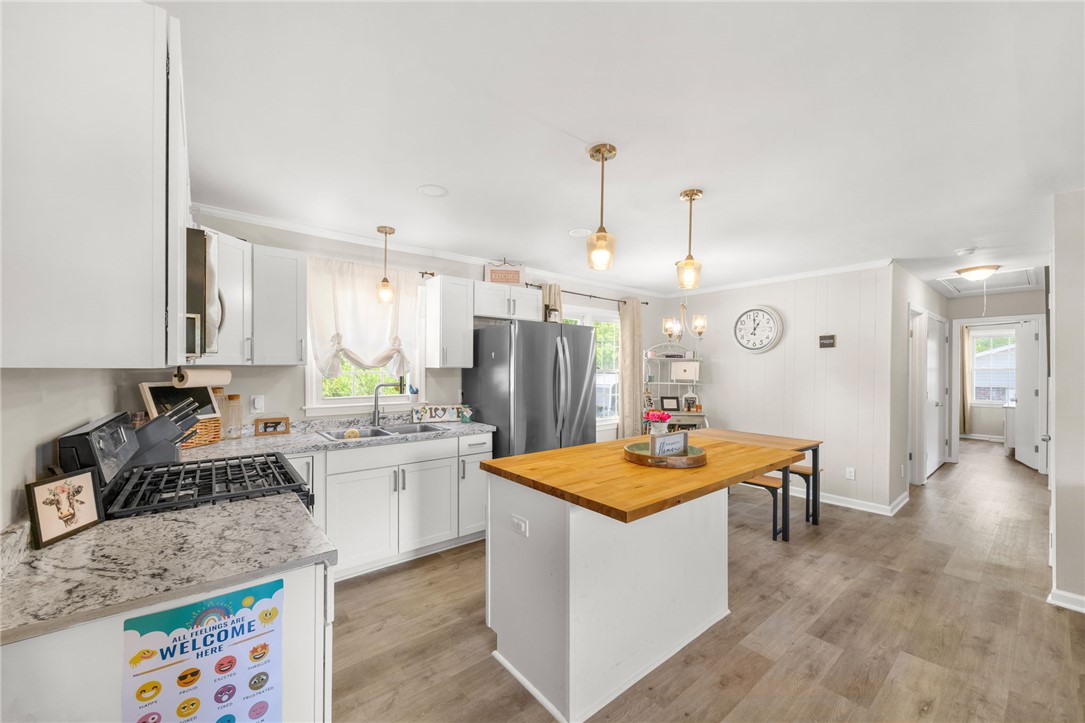 309 East Hampton Avenue Honea Path, SC 29654 - Photo 7 of 23 This bright kitchen features modern appliances and ample counter space for culinary pursuits.
