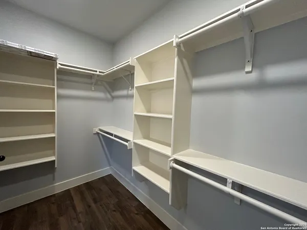 a view of an empty walk in closet