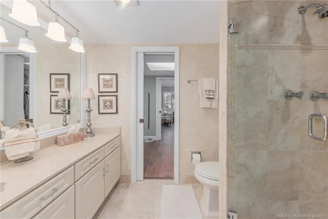 a spacious bedroom with a bed and a couch