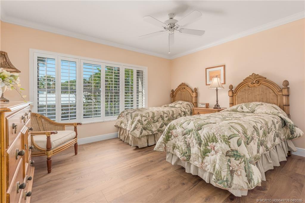 3901 Southeast St Lucie Boulevard, Unit 34 Stuart, FL 34997 - Photo 16 of 58 a spacious bedroom with a bed and a couch