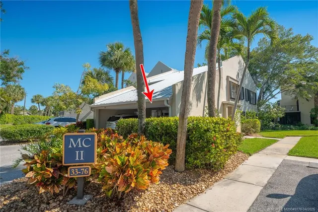 a view of a patio with table and chairs and potted plants