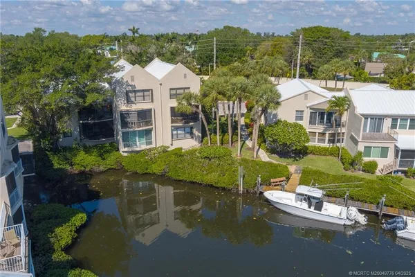 an aerial view of a house with a lake view