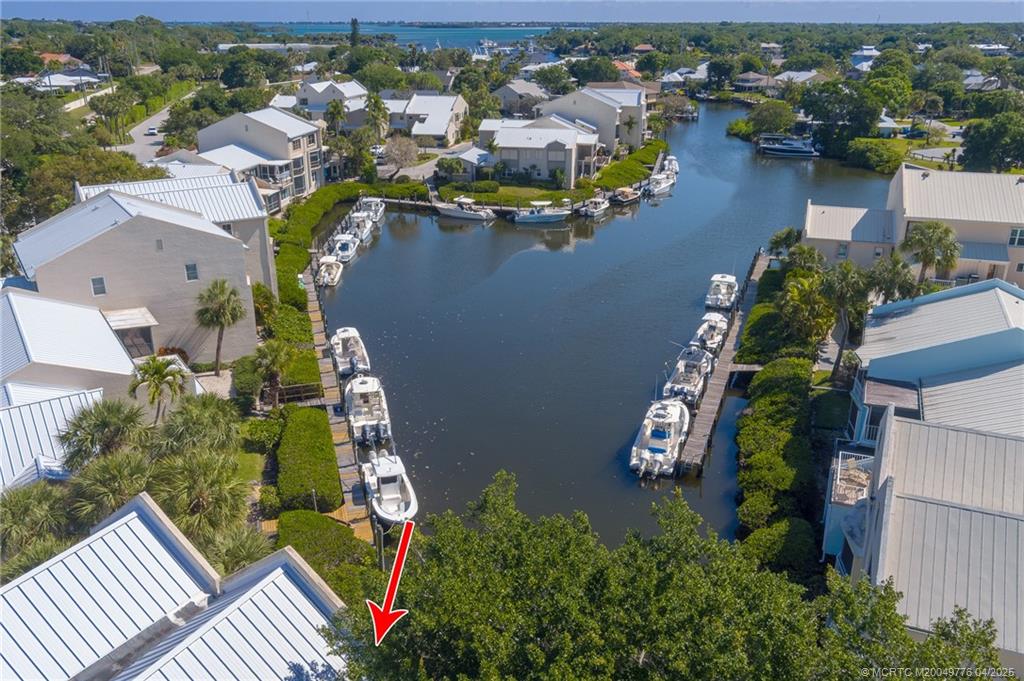 3901 Southeast St Lucie Boulevard, Unit 34 Stuart, FL 34997 - Photo 24 of 58 an aerial view of residential houses with outdoor space