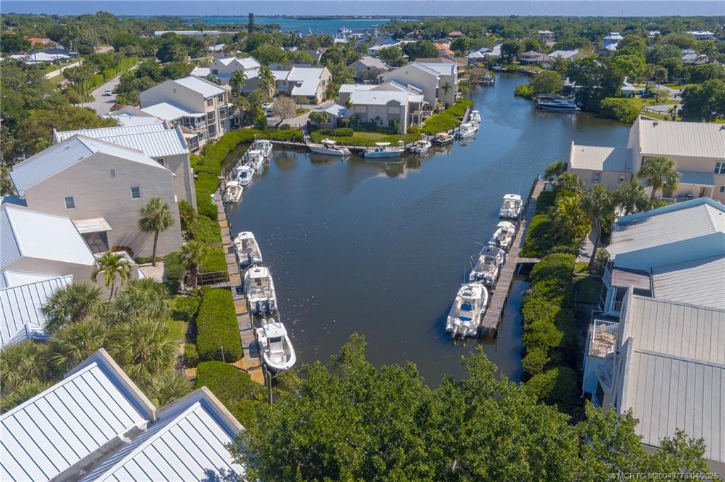 3901 Southeast St Lucie Boulevard, Unit 34 Stuart, FL 34997 - Photo 25 of 58 an aerial view of a house with a lake view