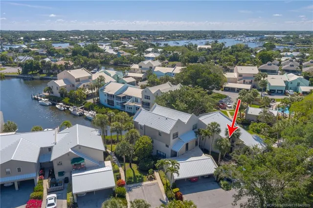 an aerial view of residential house with outdoor space and lake view
