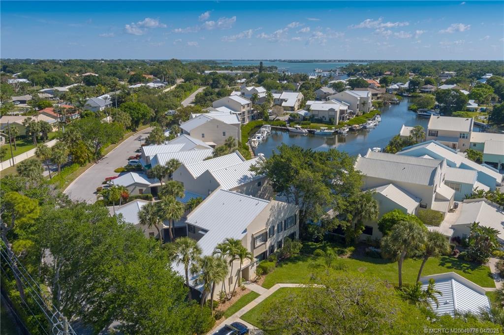 3901 Southeast St Lucie Boulevard, Unit 34 Stuart, FL 34997 - Photo 31 of 58 an aerial view of residential houses with outdoor space and river