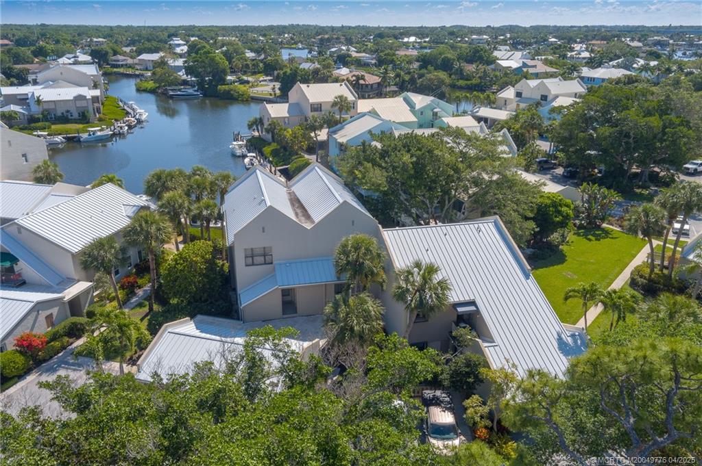 3901 Southeast St Lucie Boulevard, Unit 34 Stuart, FL 34997 - Photo 33 of 58 an aerial view of a house with outdoor space and lake view