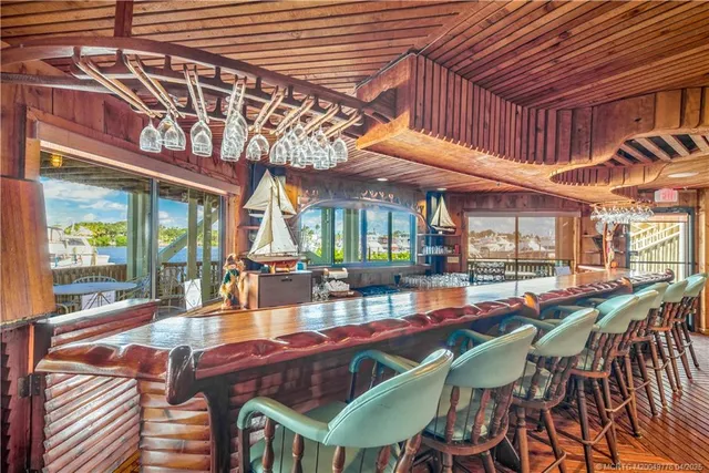 a view of a lake with chairs