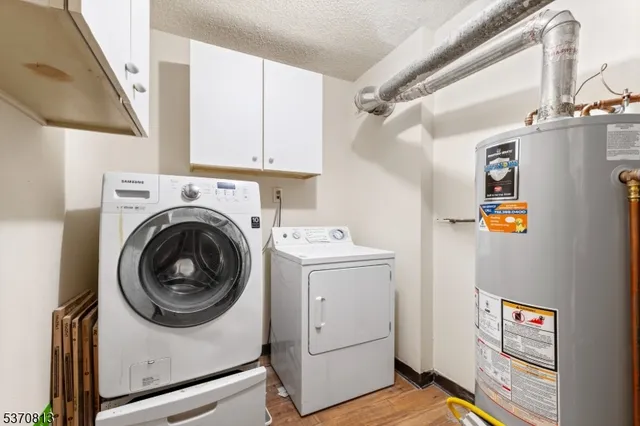 a view of storage and utility room with washer and dryer