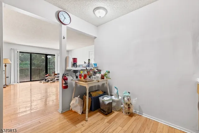 a room with wooden floor and a window