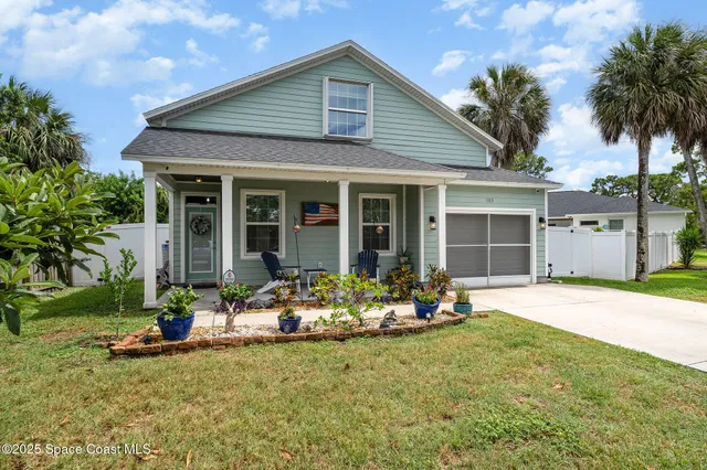 a front view of a house with garden