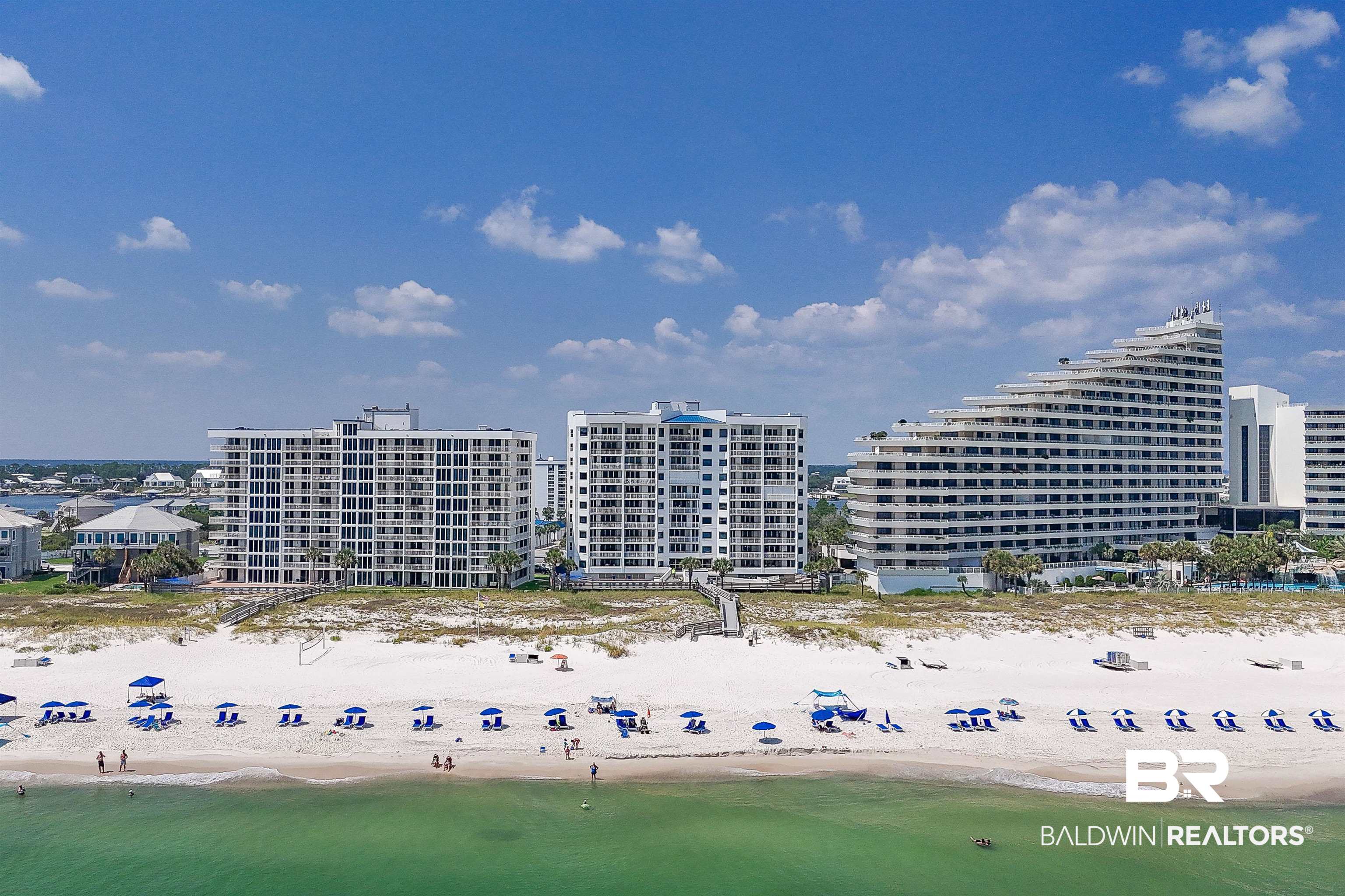 16287 Perdido Key Drive, Unit 105 Pensacola, FL 32507 - Photo 66 of 66 Expansive beachfront property featuring white sand, emerald green water, and a collection of high-rise buildings