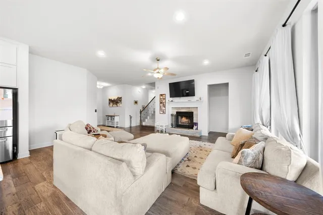 a living room with furniture fireplace and a flat screen tv