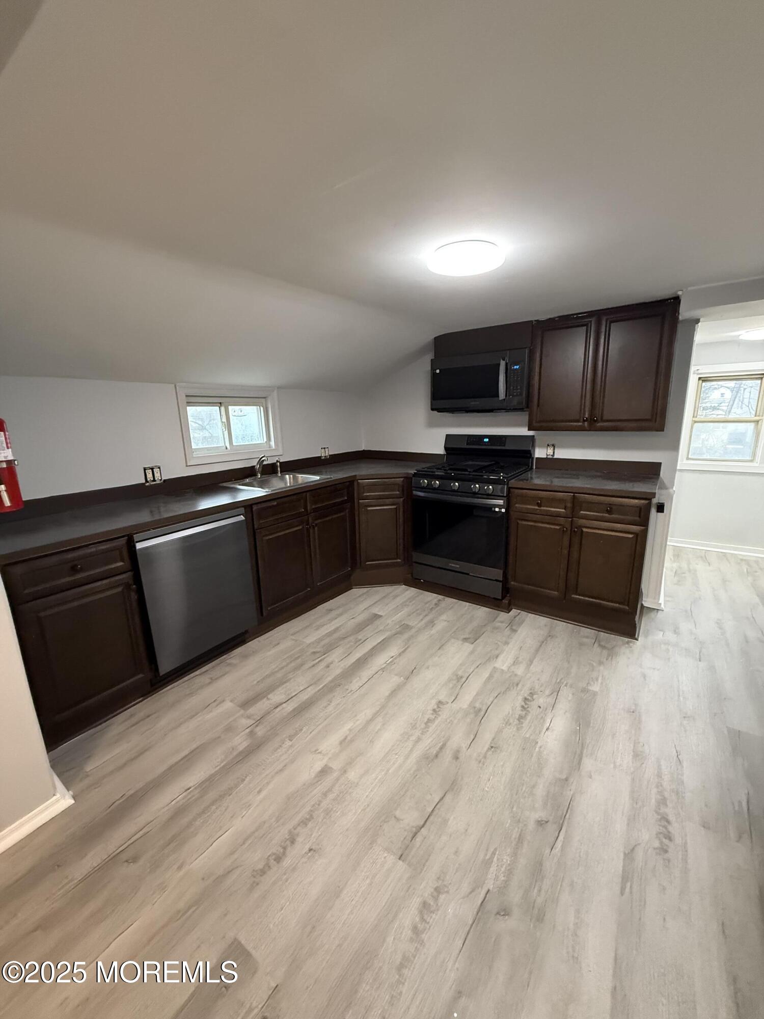 79 Pine View Avenue Keansburg, NJ 07734 - Photo 13 of 20 a kitchen with stainless steel appliances granite countertop a stove and a sink