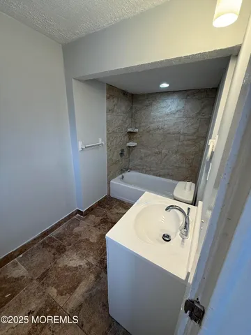 a bathroom with a sink and a tub