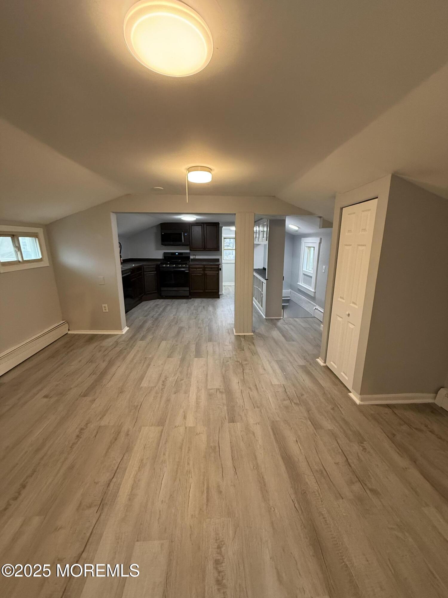 79 Pine View Avenue Keansburg, NJ 07734 - Photo 17 of 20 wooden floor in an empty room with a window