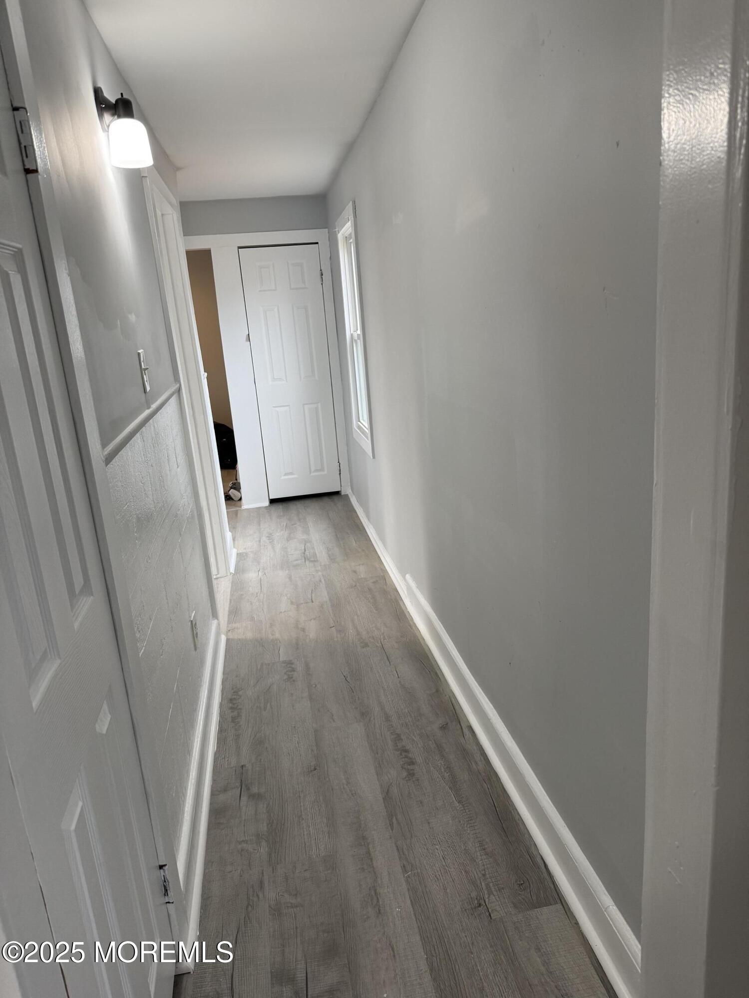 79 Pine View Avenue Keansburg, NJ 07734 - Photo 6 of 20 a view of a hallway with wooden floor