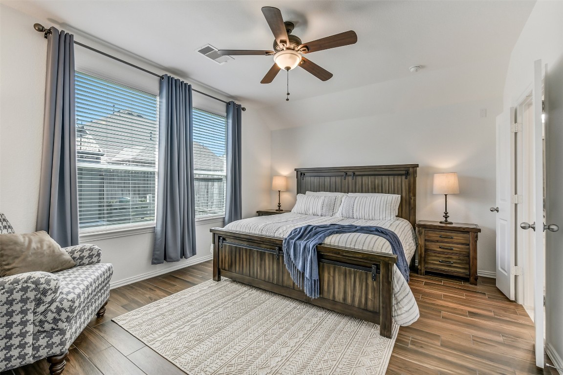 29519 Crimson Beech Drive Spring, TX 77386 - Photo 11 of 22 Primary bedroom at the back of the house has large windows that allow natural light.