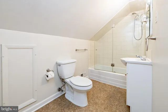 a bathroom with a sink a mirror a bathtub and shower