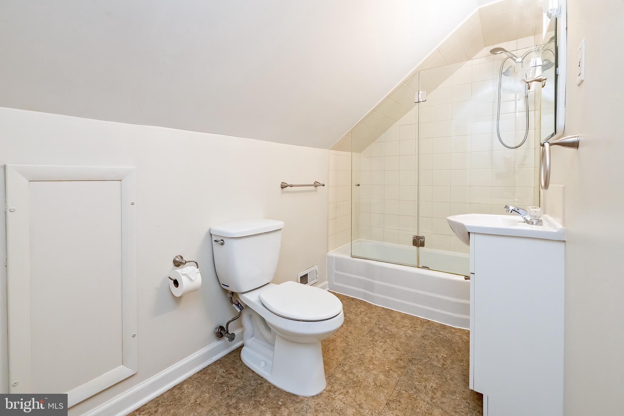 1305 Sylvan Drive Haddon Heights, NJ 08035 - Photo 16 of 25 a white toilet sitting next to a bathroom sink and a shower