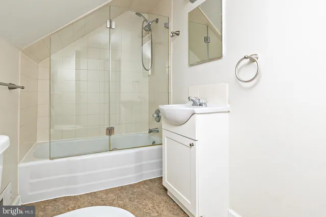 a front view of a house with a yard garage and outdoor seating