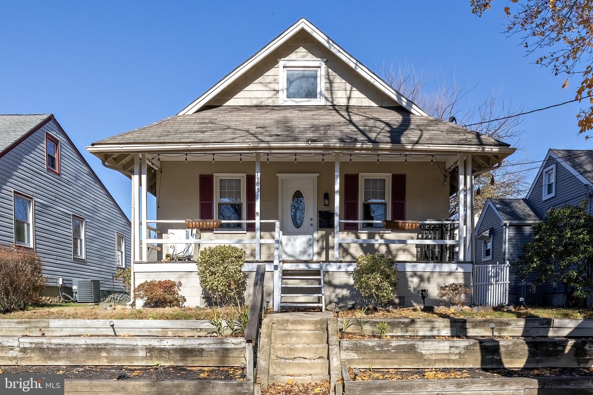 1305 Sylvan Drive Haddon Heights, NJ 08035 - Photo 2 of 25 a view of a white house with large windows