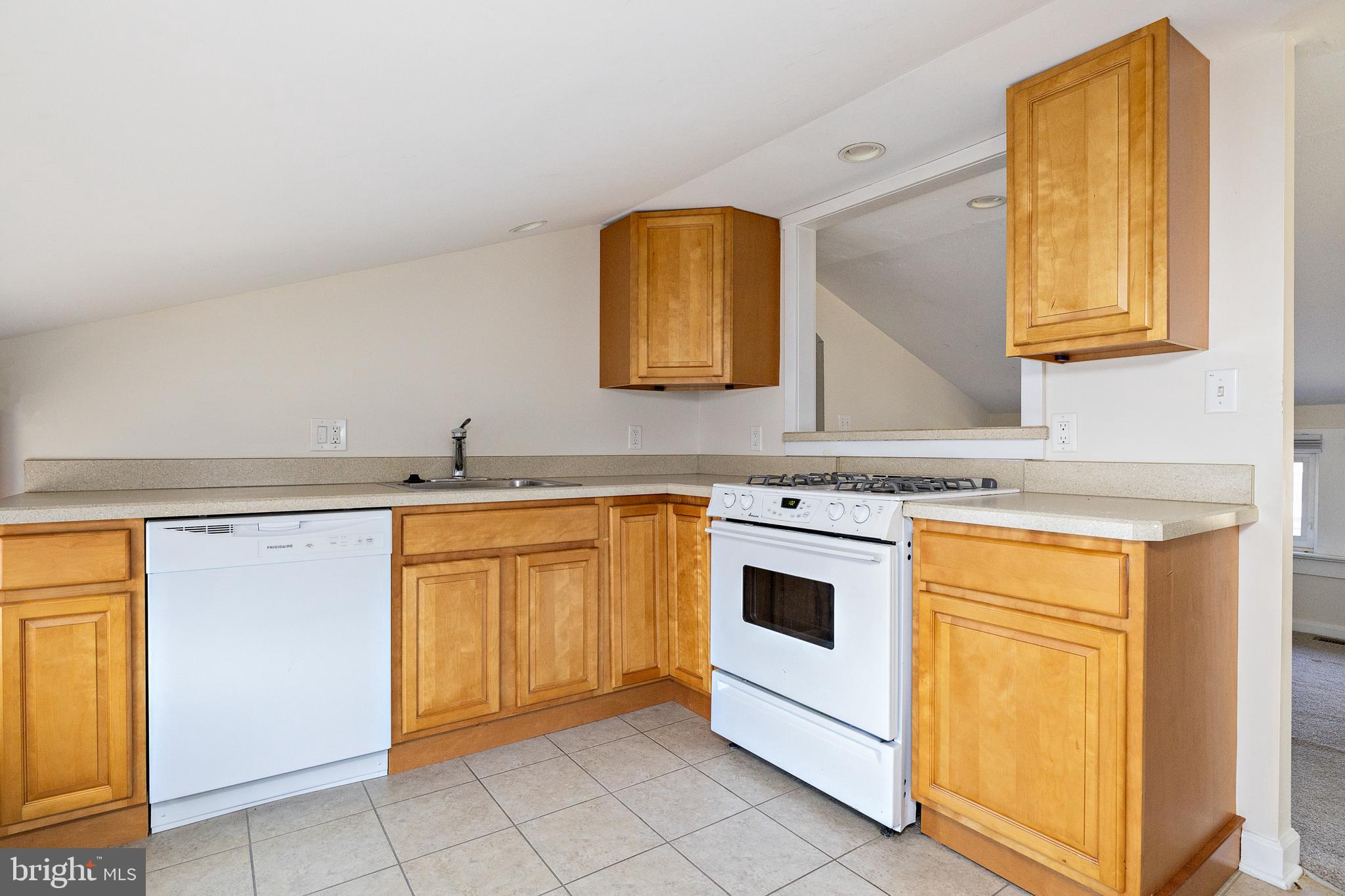 1305 Sylvan Drive Haddon Heights, NJ 08035 - Photo 10 of 25 a kitchen with stainless steel appliances granite countertop a sink and a stove top oven