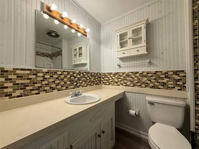 a bathroom with a sink and a toilet